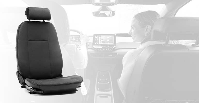 The Caroseat Flex seat superimposed over a faded image of two women sitting in a car. 